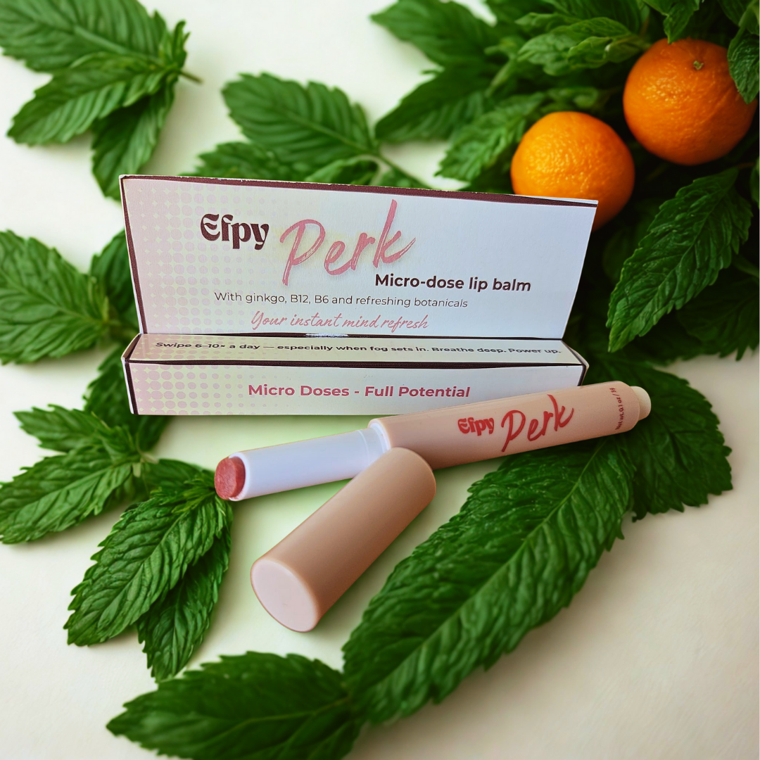 Efpy Perk micro-dose lip balm surrounded by sweet orange and peppermint
