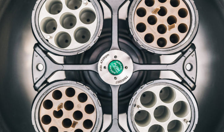 Close-up of a four-socket tool with a brand logo on a dark background