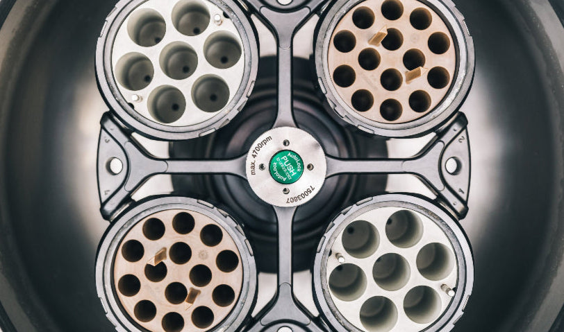 Close-up of a four-socket tool with a brand logo on a dark background